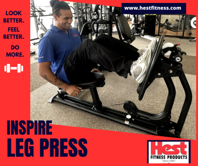 Caleb Harris trying out the Inspire Leg Press that is attached to an M3 Home Gym