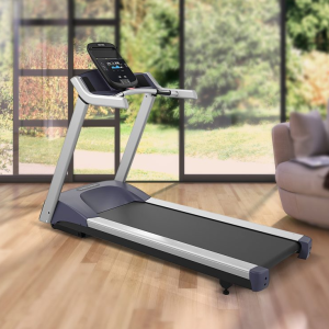 Vectra TM-220 treadmill inside a home with windows that look out into a peaceful backyard.