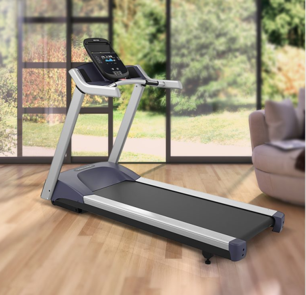 Vectra TM-220 treadmill inside a home with windows that look out into a peaceful backyard.